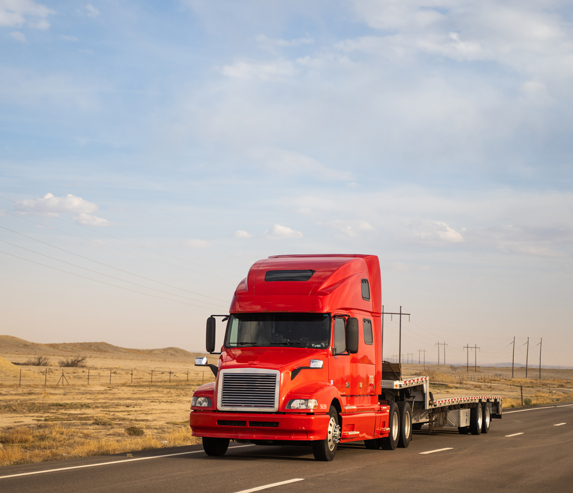 Red truck on open highway