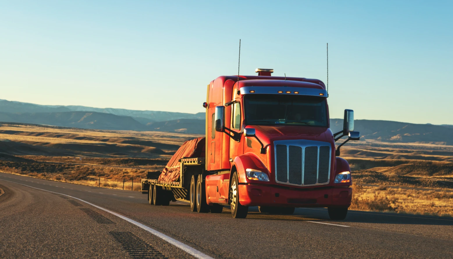 Semi-truck driving through countryside