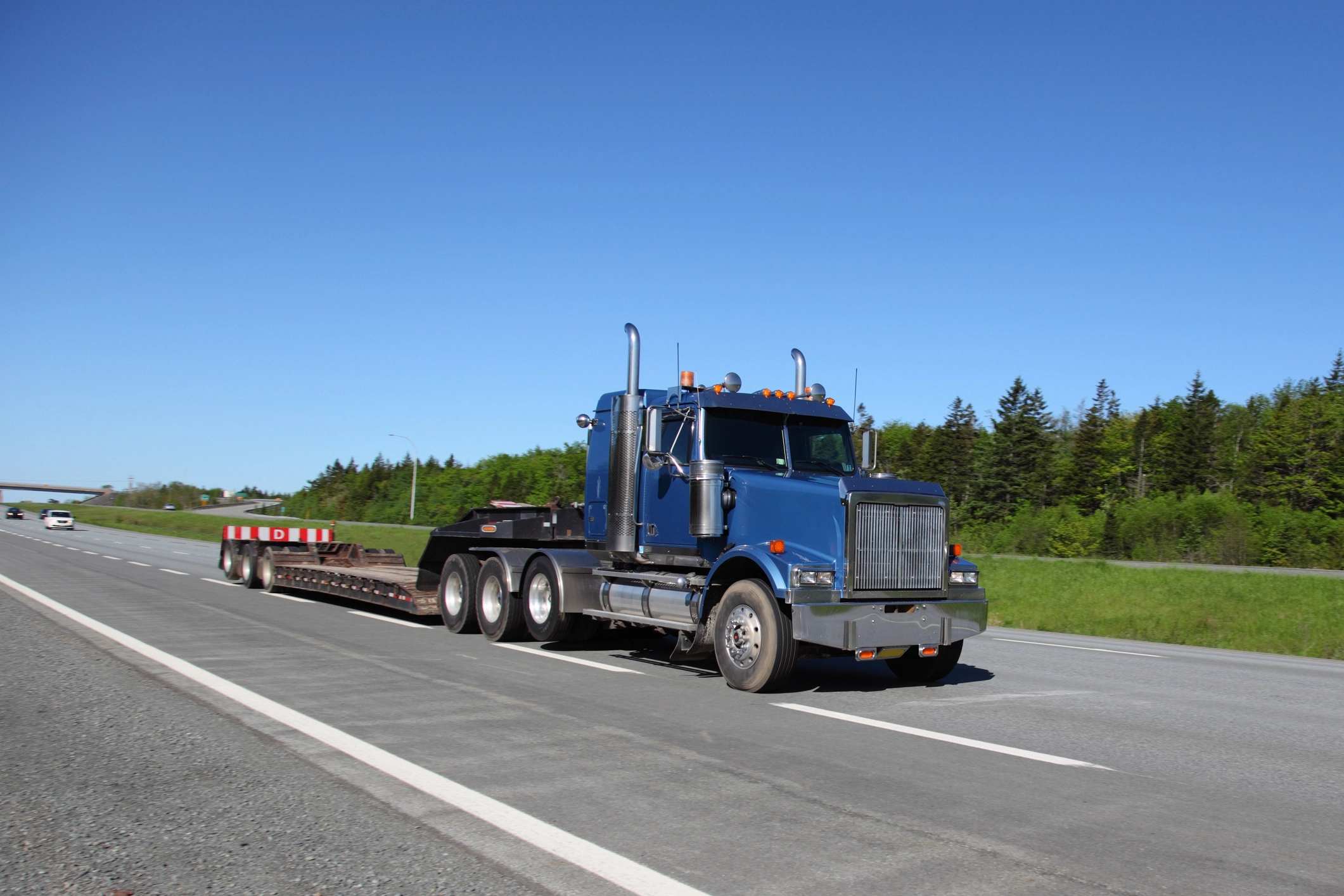 Semi-truck driving on rural road